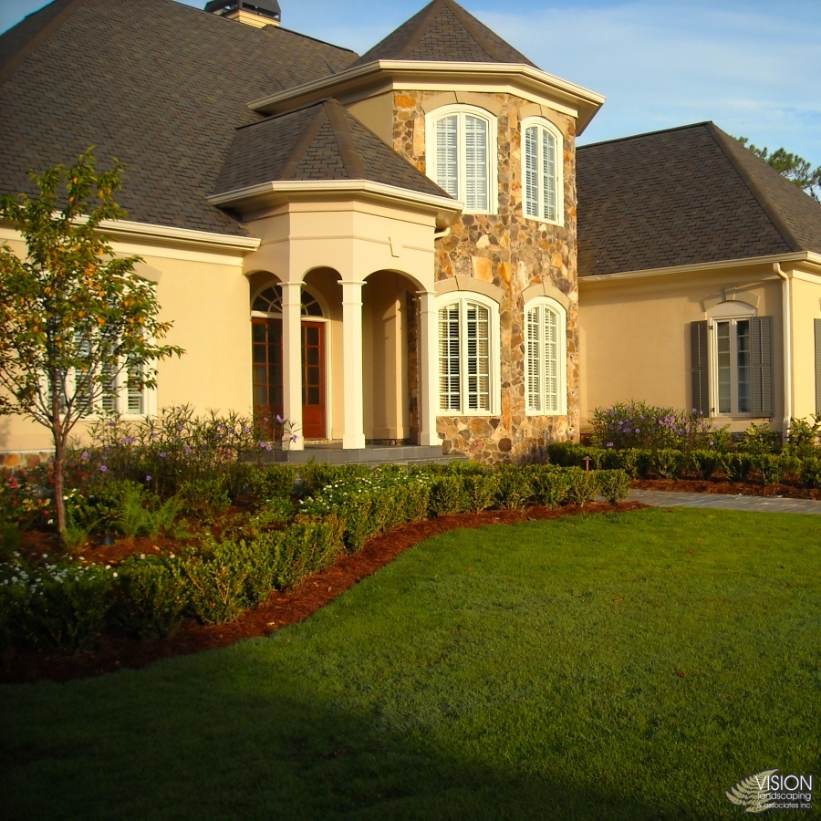 Outdoor living space highlighting patio stonework and lighting.